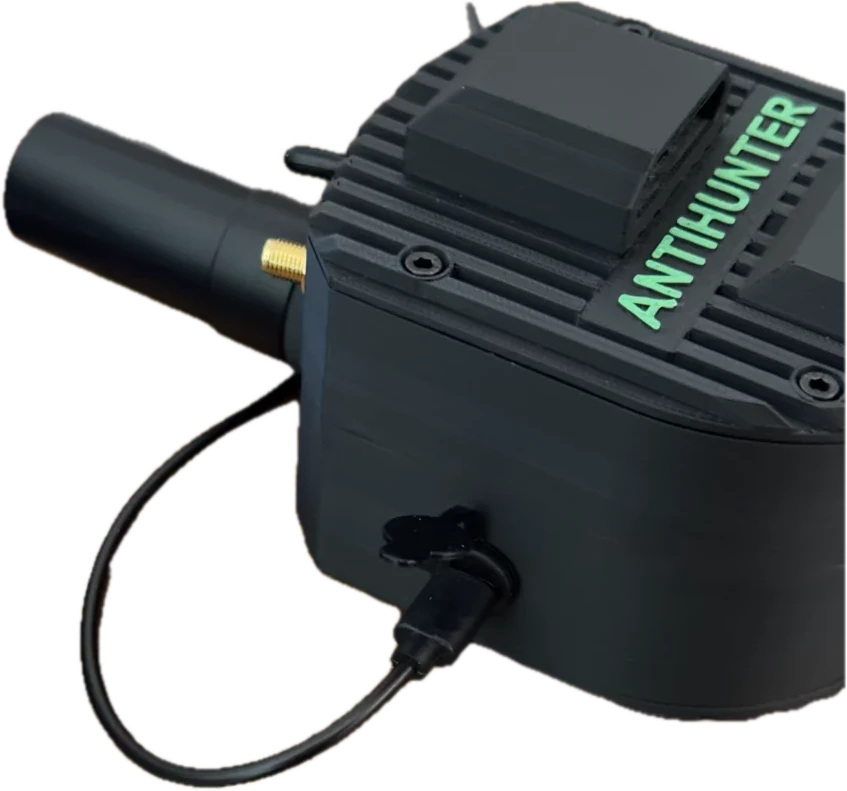AntiHunter node close-up with weatherproof USB-C cap and connectors